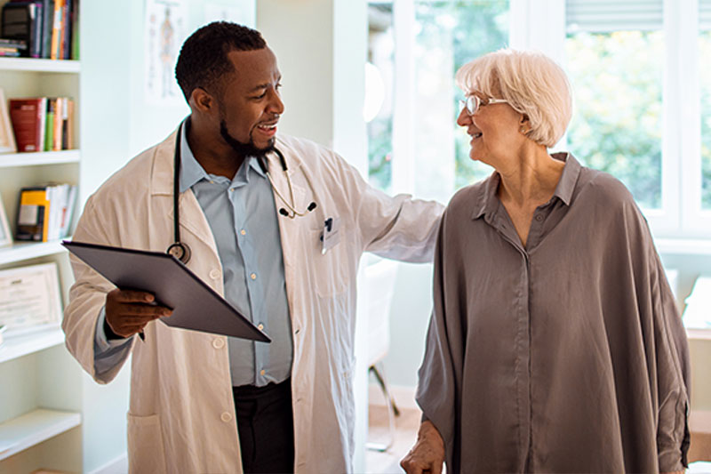 doctor medical assessment with senior lady after fall