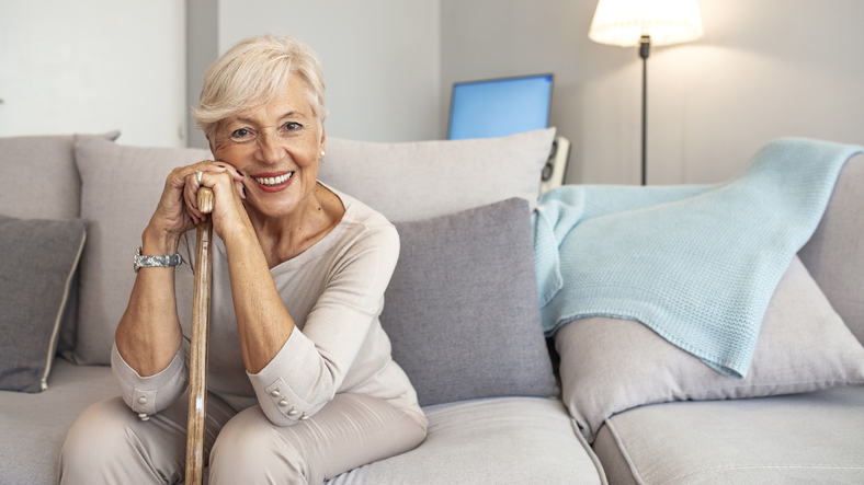 beautiful senior lady leaning on cane